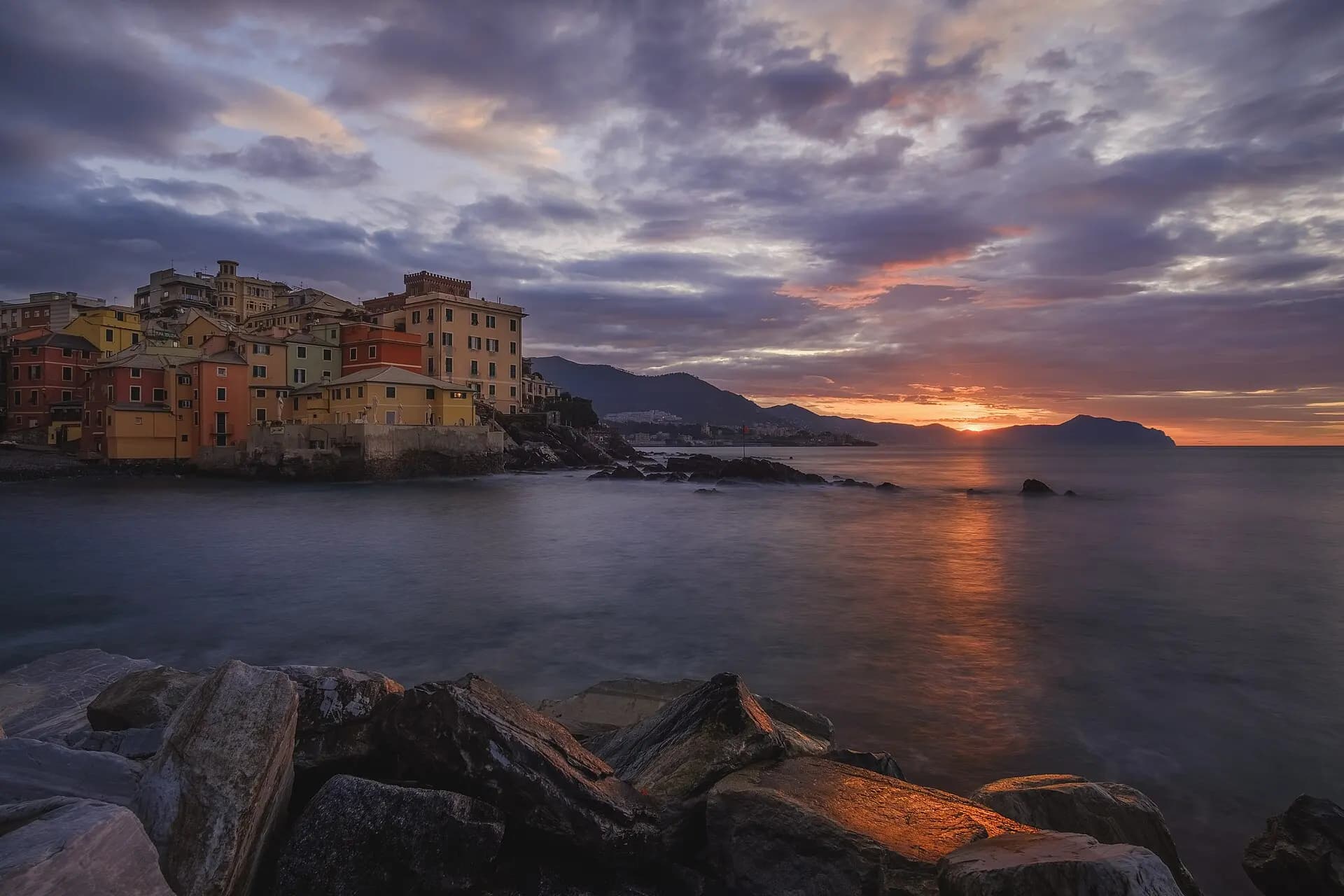 Boccadasse at dawn, with the Portofino headland on the horizon